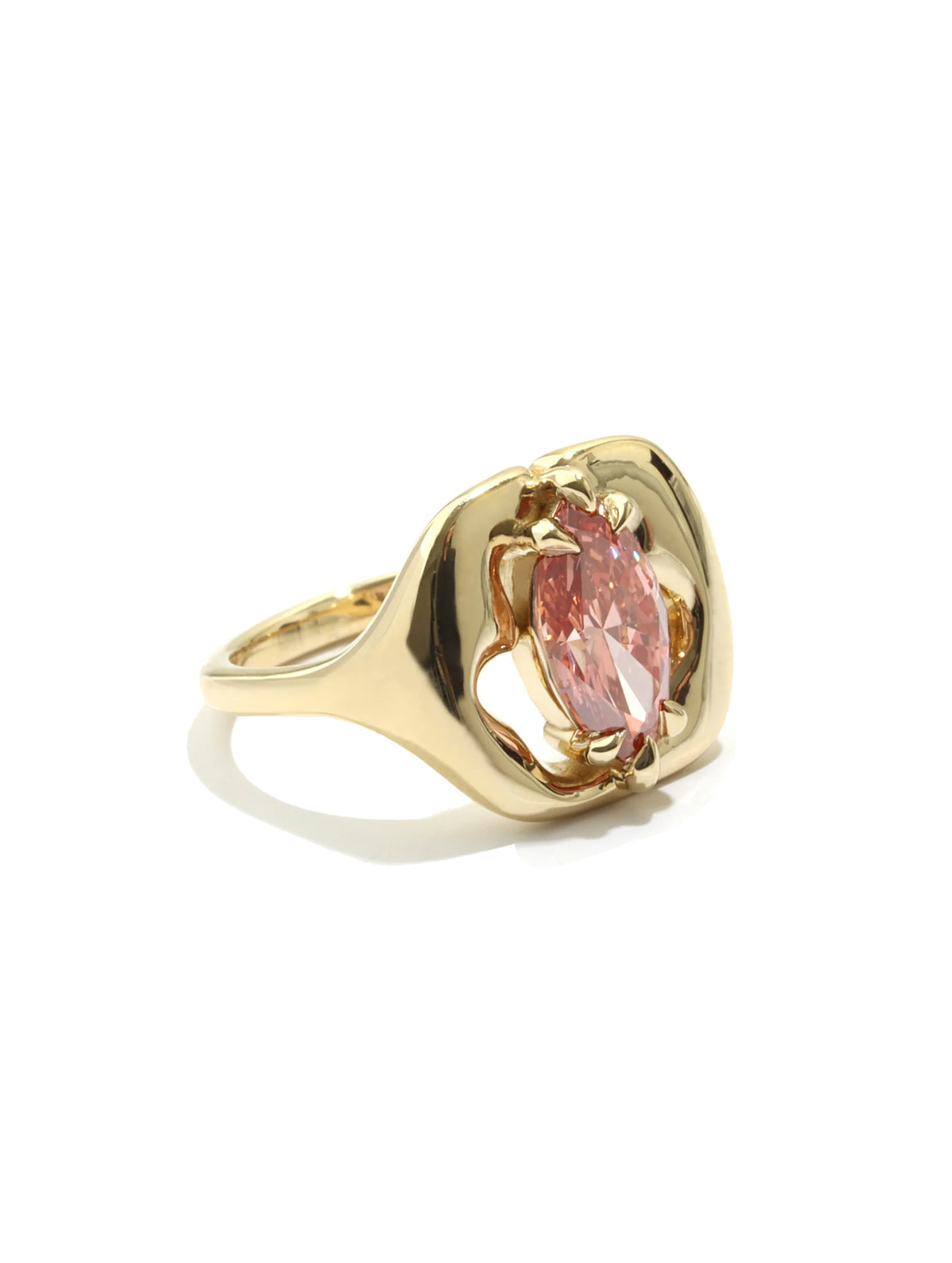 A gold ring featuring a marquise-cut pink gemstone in a sculptural, openwork setting, shown on a clean white background with a soft shadow.