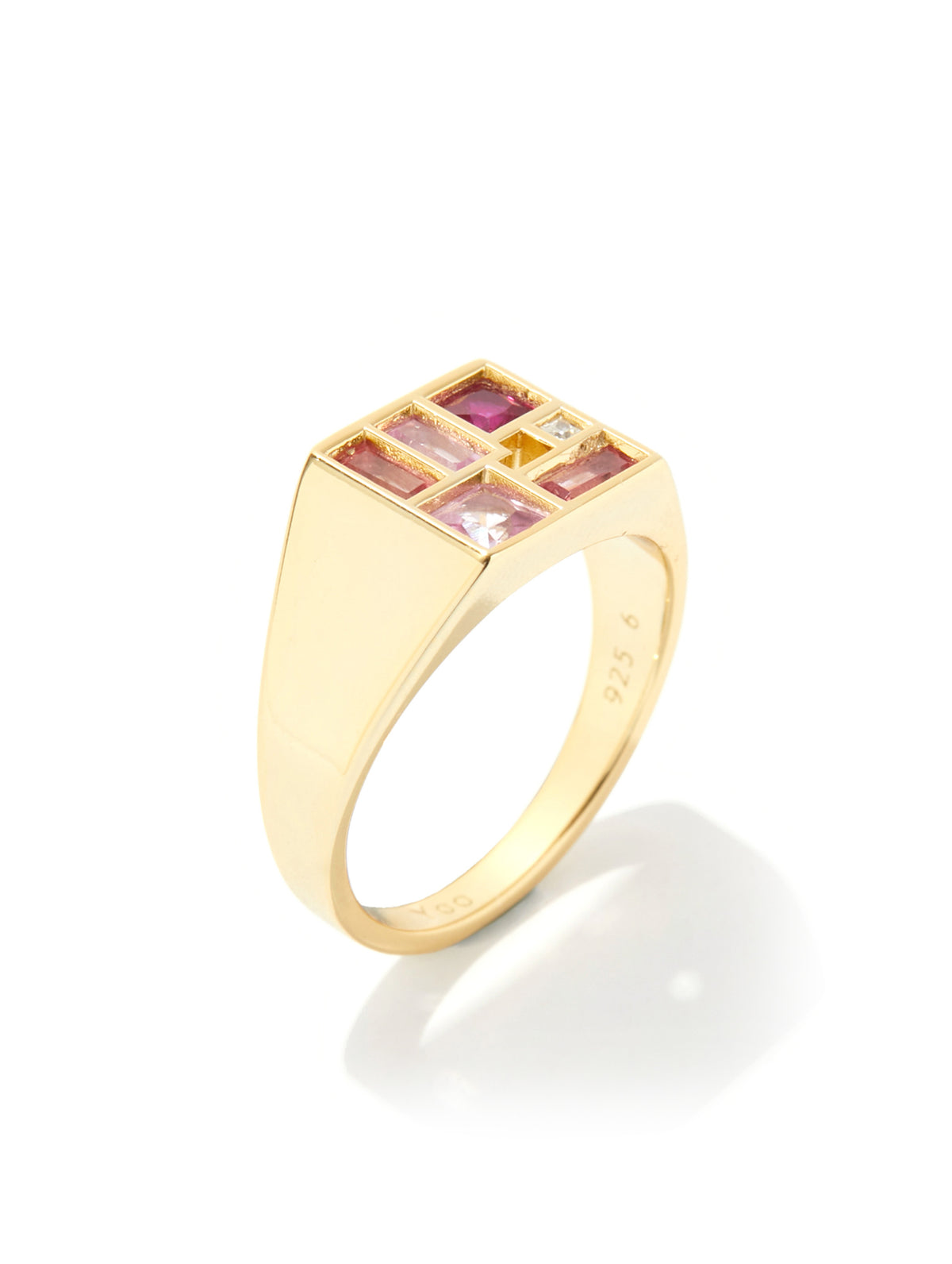 A yellow gold signet ring featuring a square top set with alternating pink and clear gemstones, shown on a clean white background with a soft reflection.