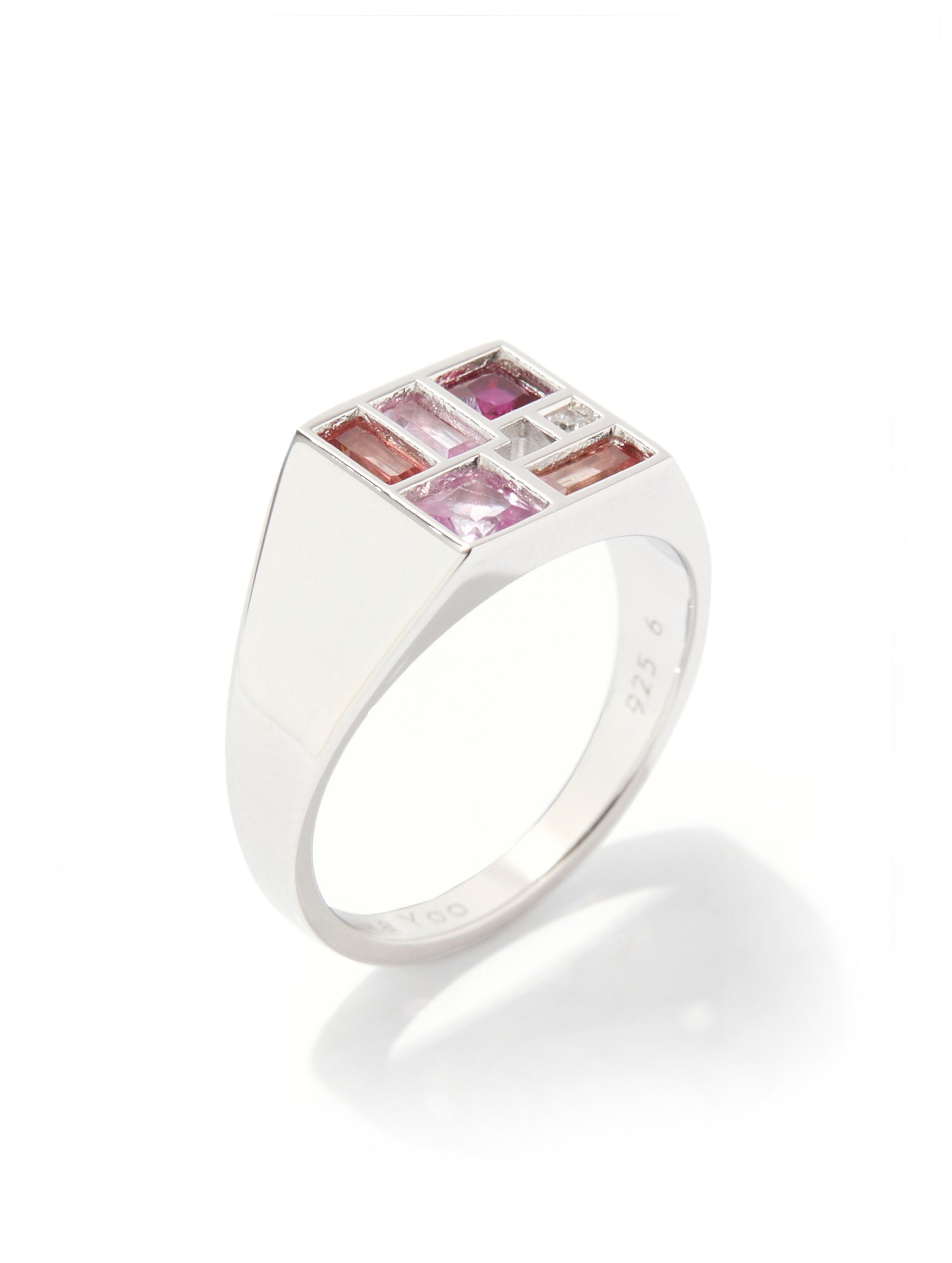 A silver signet ring featuring a square top set with pink baguette-cut gemstones and small clear accent stones, shown on a clean white background with a soft reflection.
