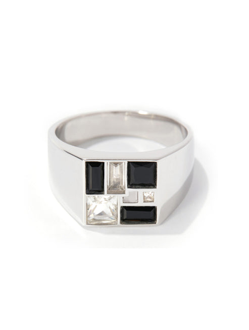 A silver-toned geometric signet ring featuring black rectangular and clear baguette stones, photographed on a clean white background.