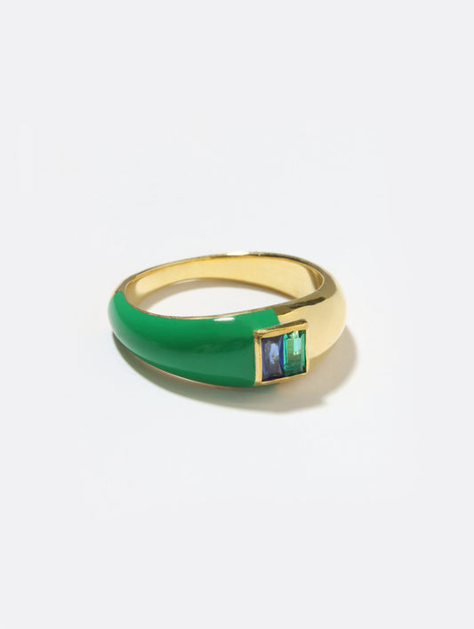A gold ring with a thick green enamel band and a square bezel-set green stone, photographed on a clean white background.