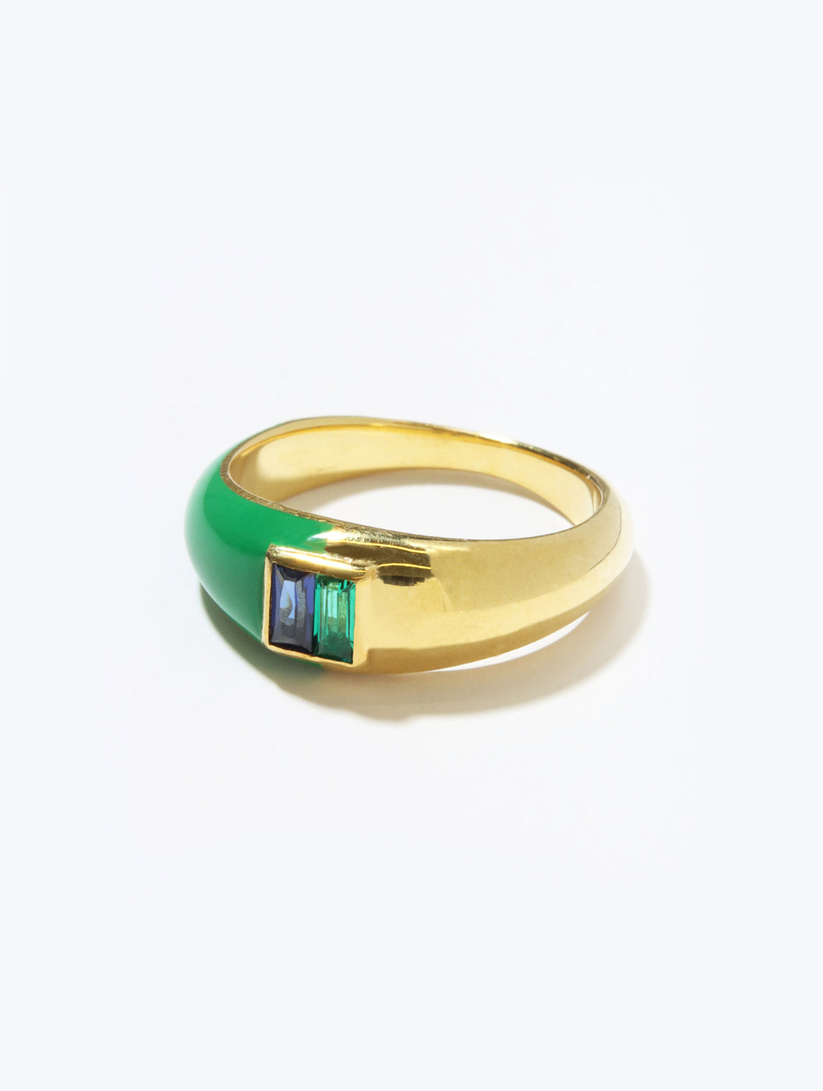 A gold signet ring featuring a smooth green enamel inlay and a rectangular bezel-set cluster of iridescent blue and green stones, shown on a clean white background.