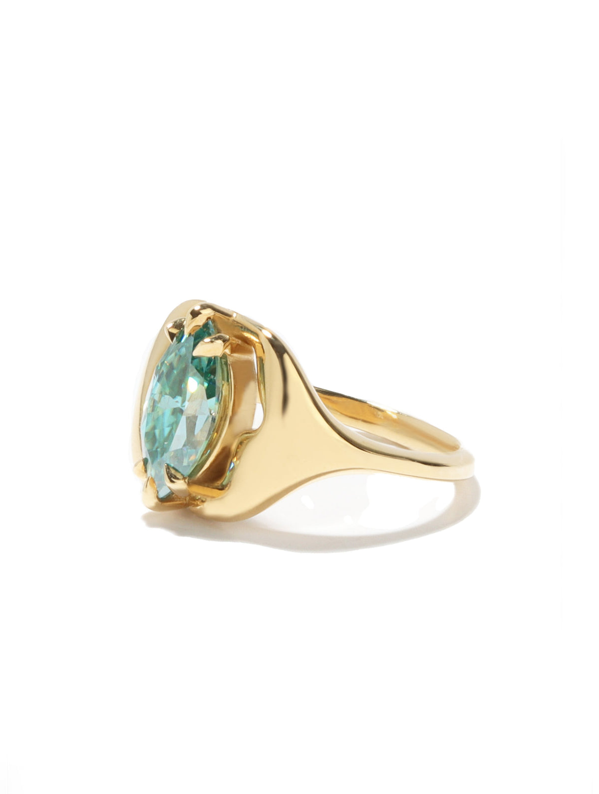 A gold ring featuring a marquise-cut light blue gemstone in a prong setting, shown on a clean white background with a soft shadow.