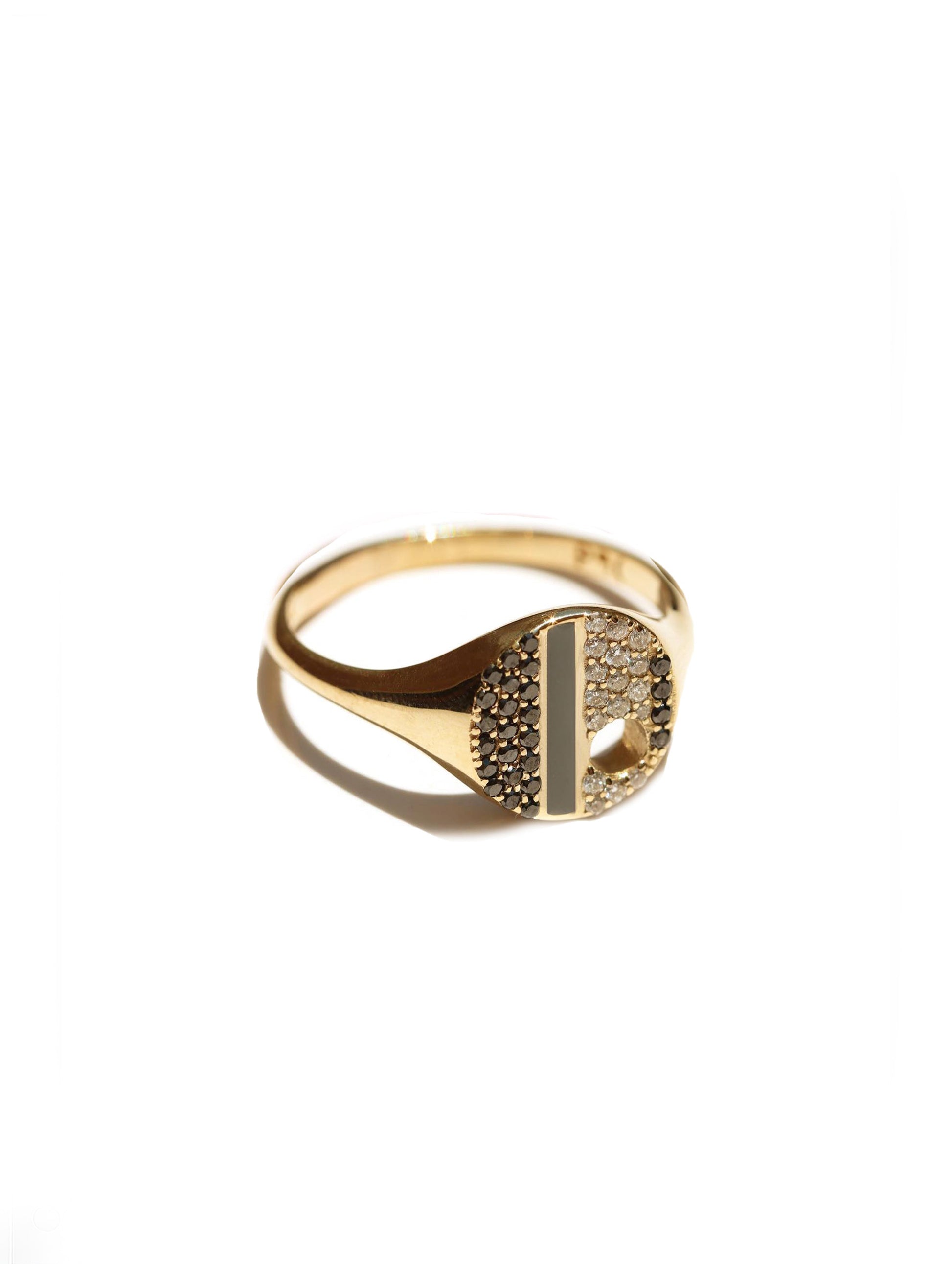 A gold signet ring featuring a raised letter 'H' face paved with small clear stones on one side and a polished gold vertical bar on the other, set against a plain white background.
